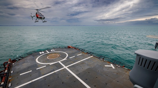 drone helicopter landing on a ship deck