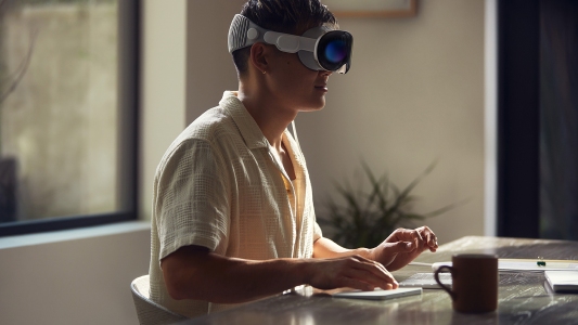 a person working wearing Apple's AR headset
